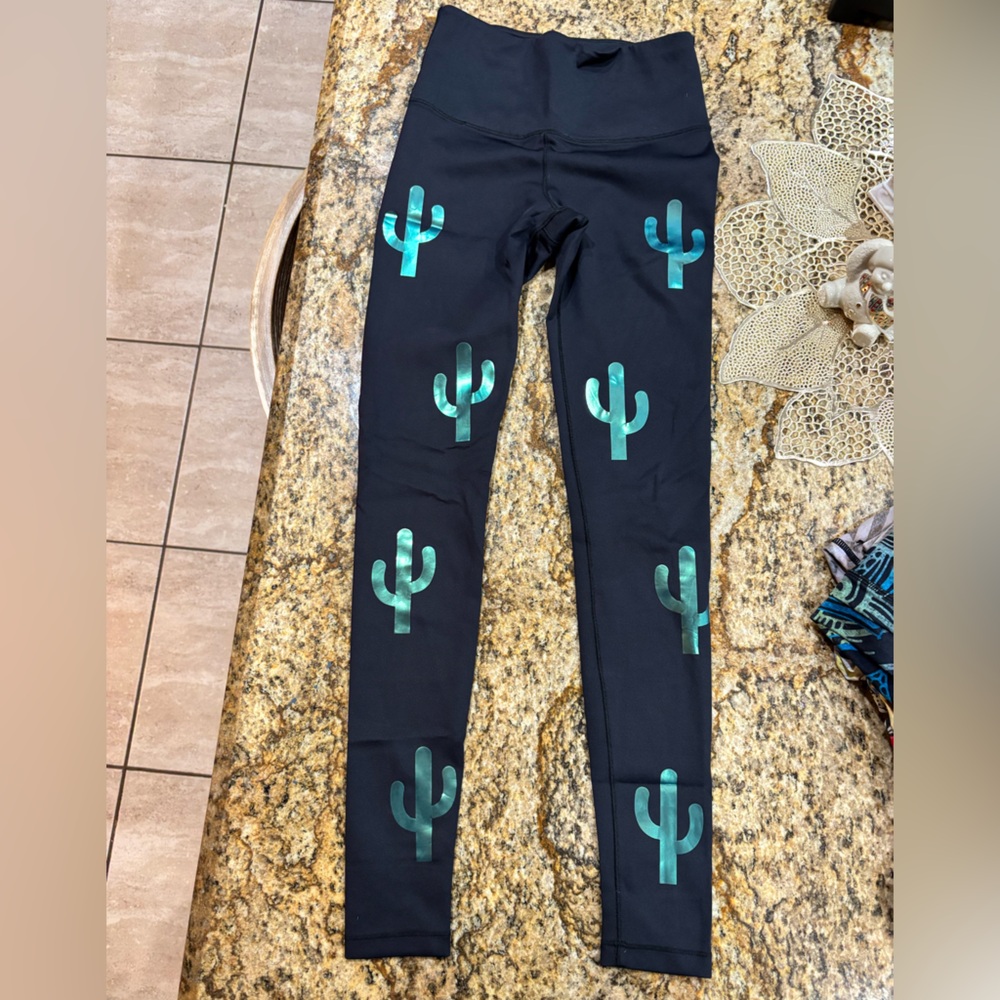 Woman’s Long Noli Black Leggings With A Shiny Teal Cactus Design